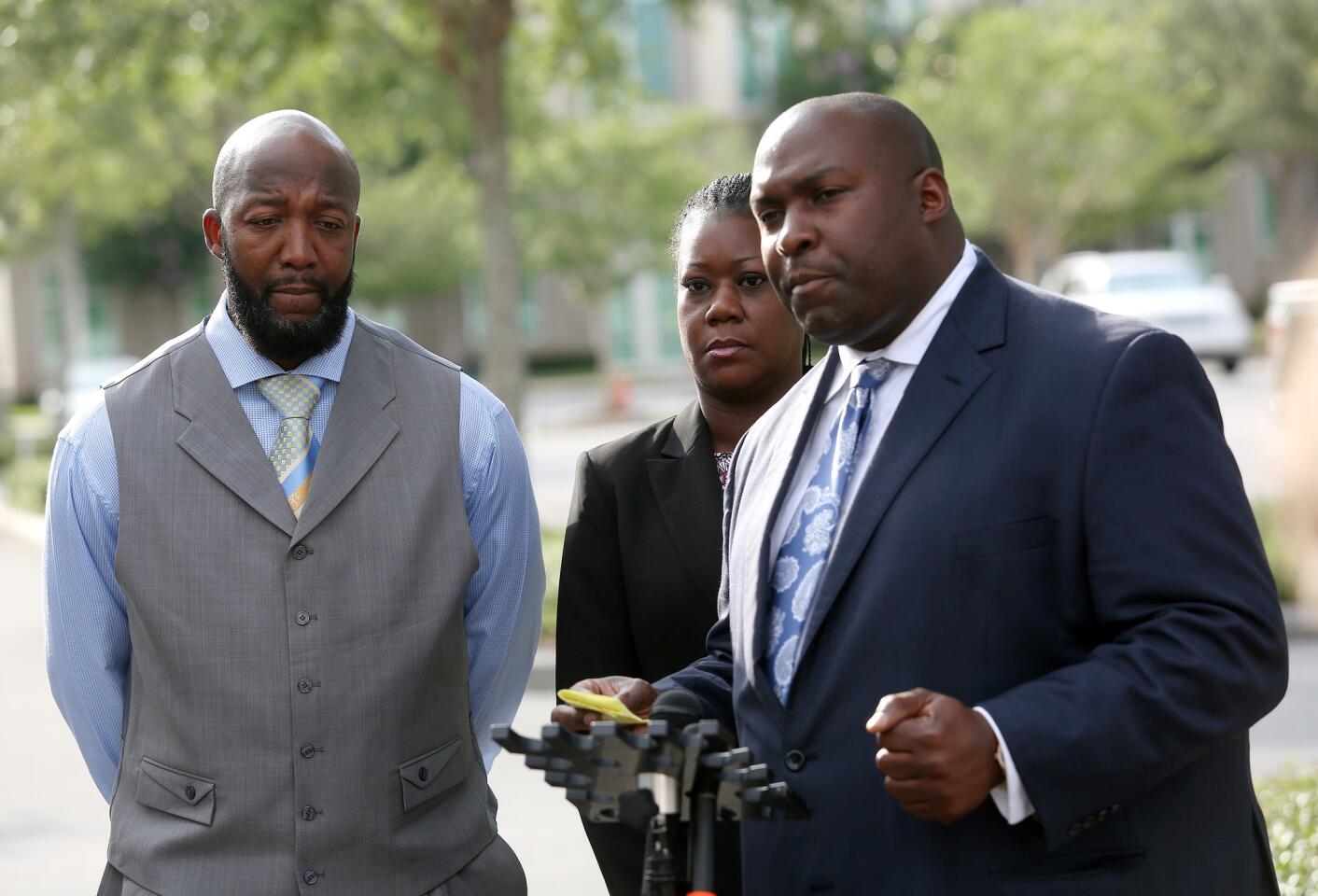Family attorney Daryl Parks gives a press conference with Tracy Martin and Sybrina Fulton after the day's proceedings of George Zimmerman's trial in Seminole circuit court in Sanford, Fla. Thursday, June 27, 2013. Zimmerman has been charged with second-degree murder for the 2012 shooting death of Trayvon Martin. (Jacob Langston/Orlando Sentinel)