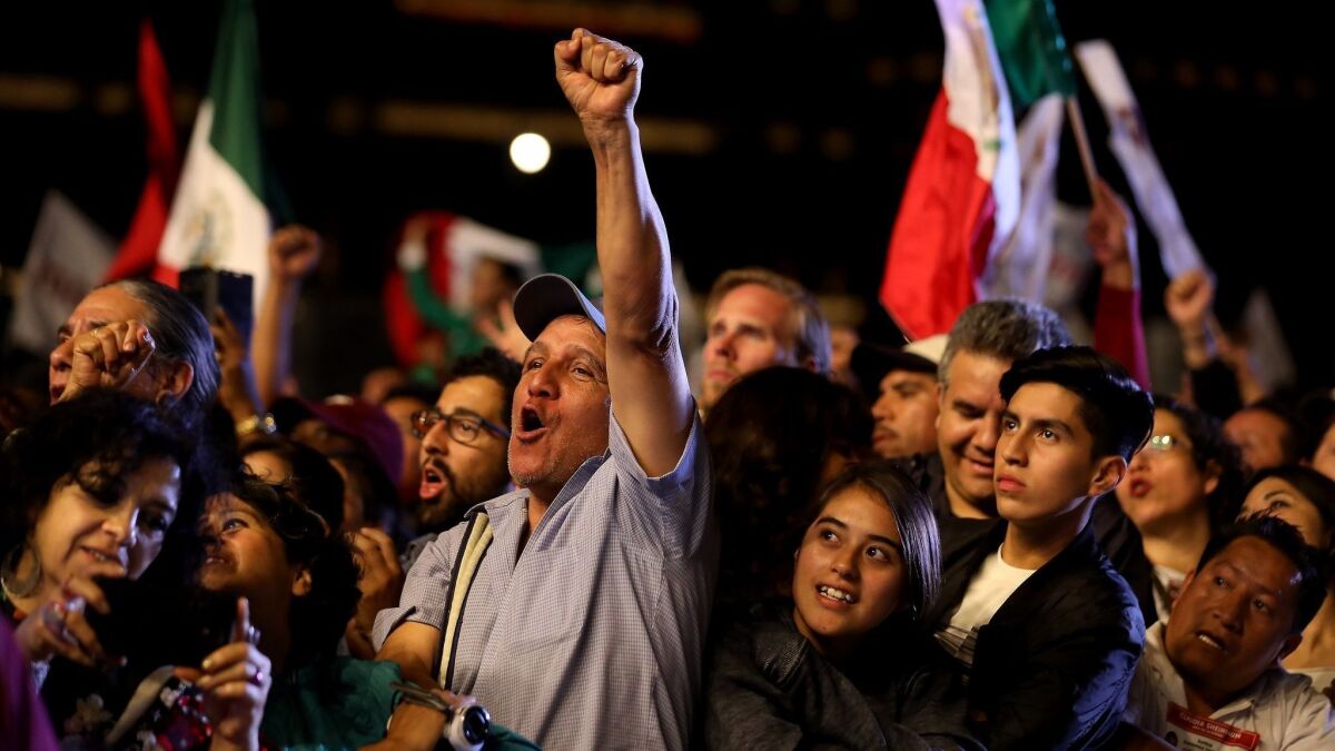 Supporters of Andres Manuel Lopez Obrador celebrate in Mexico City's Zocalo after getting the preliminary results of the general elections on July 2.