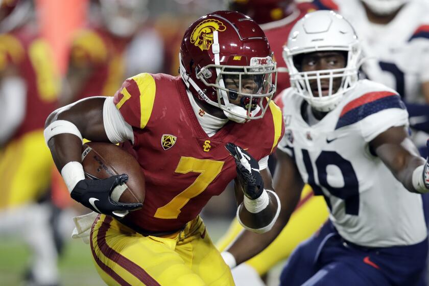 Southern California running back Stephen Carr (7) runs against Arizona during the first half.