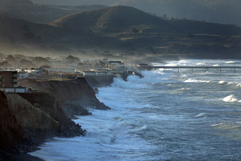 Large waves pummel the coast of Pacifica. State lawmakers are grappling with the many threats looming over the California coast as sea levels continue to rise.