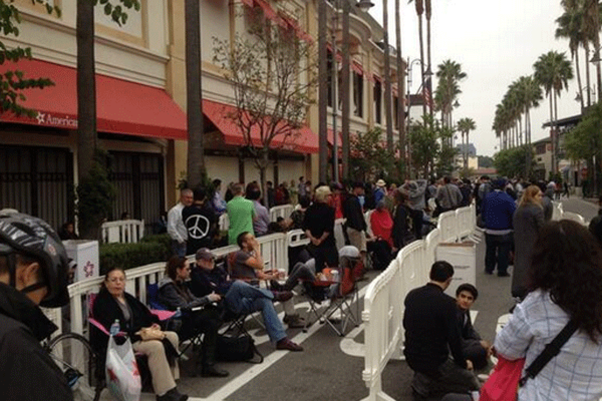Free coffee and bottled water were some comfort to the hundreds lined up to get their new iPhone outside the Grove Apple store in Los Angeles.