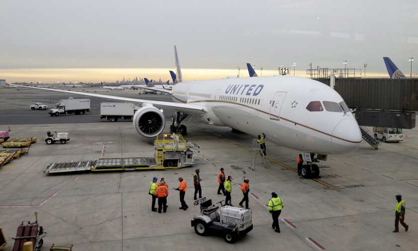 FILE - A Dreamliner 787-10 arriving from Los Angeles pulls up to a gate at Newark Liberty International Airport in Newark, N.J., Monday, Jan. 7, 2019. Federal safety officials are directing operators of some Boeing planes to adopt extra procedures when landing on wet or snowy runways near impending 5G service because, they say, interference from the wireless networks could mean that the planes need more room to land. The Federal Aviation Administration said Friday, Jan. 14, 2022, that interference could delay systems like thrust reversers on Boeing 787s from kicking in, leaving only the brakes to slow the plane. (AP Photo/Seth Wenig, File)
