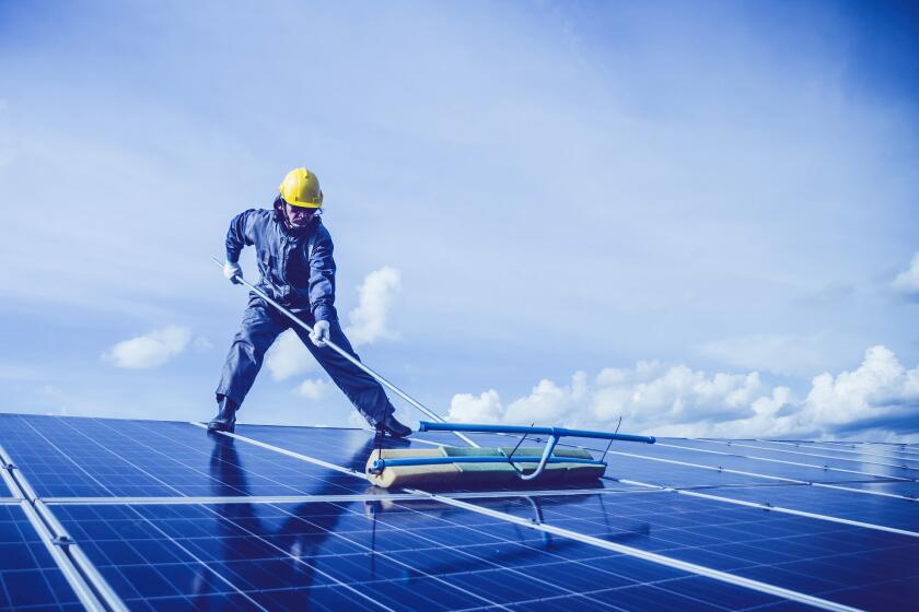 A worker working on solar.