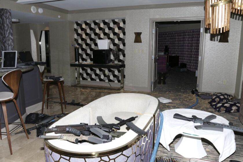 FILE - This Oct. 2017 file photo released by the Las Vegas Metropolitan Police Department Force Investigation Team Report shows a number of guns in the interior of mass shooter Stephen Paddock's 32nd floor room of the Mandalay Bay hotel in Las Vegas. Paddock a high-roller gambler who opened fire in 2017 on concertgoers in Las Vegas had lost tens of thousands of dollars while gambling weeks before the mass shooting and was upset with the way the casinos had been treating him, according to FBI documents made public this week. (Las Vegas Metropolitan Police Department via AP, File)