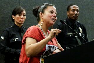 Melina Abdullah addresses a Police Commission meeting at LAPD headquarters
