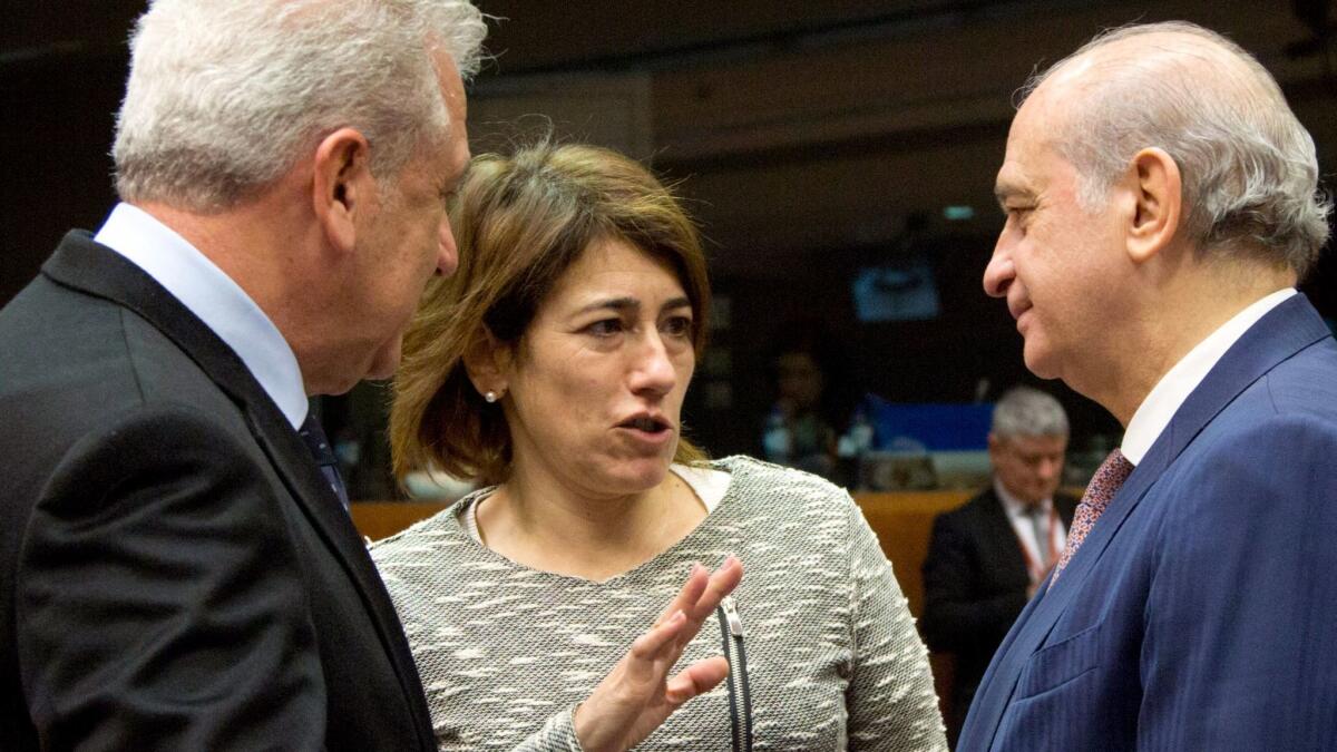 Portuguese Interior Minister Constanca Urbano de Sousa, center, talks with Spanish Interior Minister Jorge Fernandez Diaz, right, and European Commissioner Dimitris Avramopoulos on March 10, 2016, in Brussels. De Sousa resigned after 106 people were killed in fires this year.