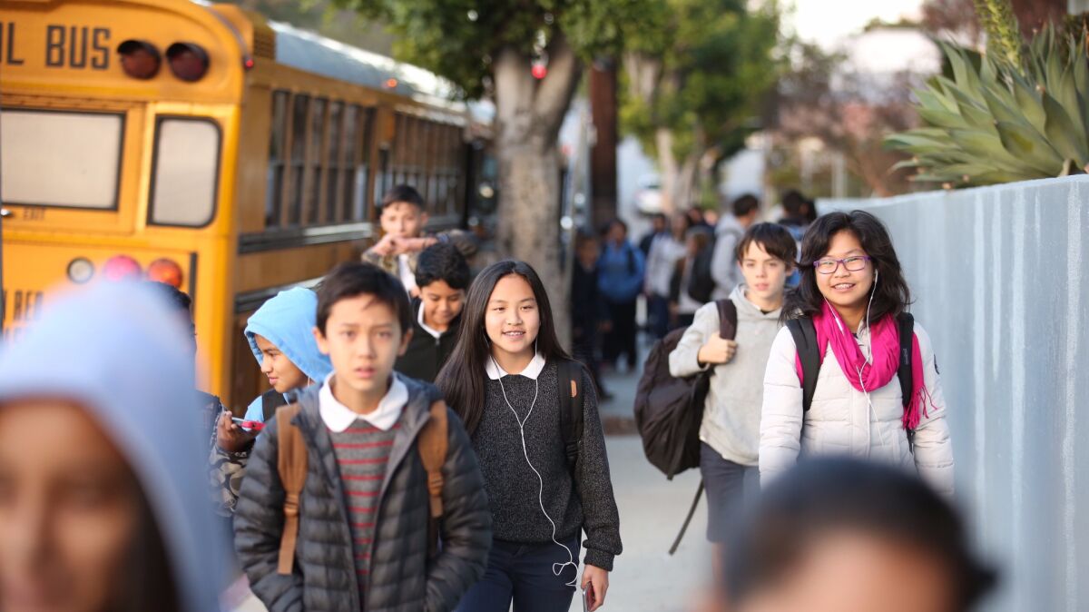 L.A. Unified students walk into Thomas Starr King Middle School in East Hollywood in December. How will money be spent on them this year?