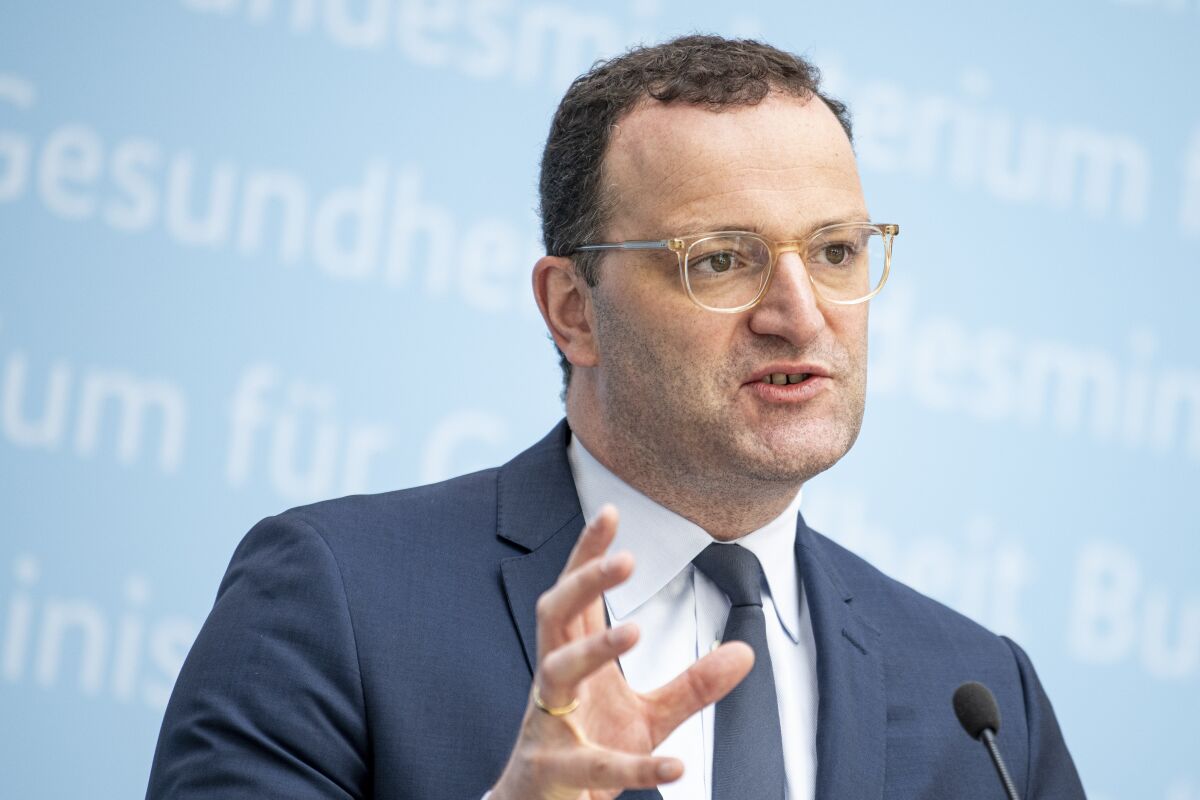 Jens Spahn (CDU), Germany's Federal Minister of Health, comments at a press conference on the consequences of the STIKO recommendation to administer an mRNA vaccine after a first vaccination with Astrazeneca in Berlin, Germany, Friday, July 2, 2021. (Fabian Sommer/dpa via AP)