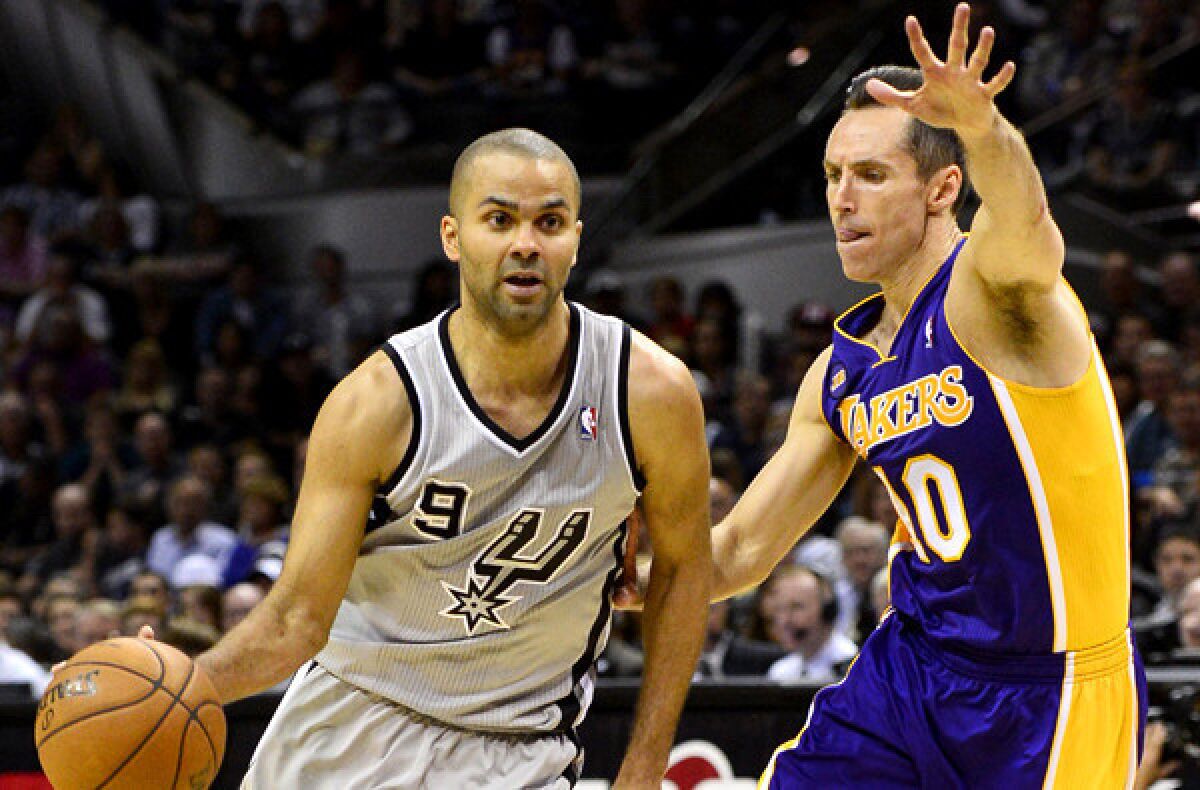 Lakers point guard Steve Nash tries cut off a drive by Spurs point guard Tony Parker in the second half of Game 1 on Sunday afternoon in San Antonio.