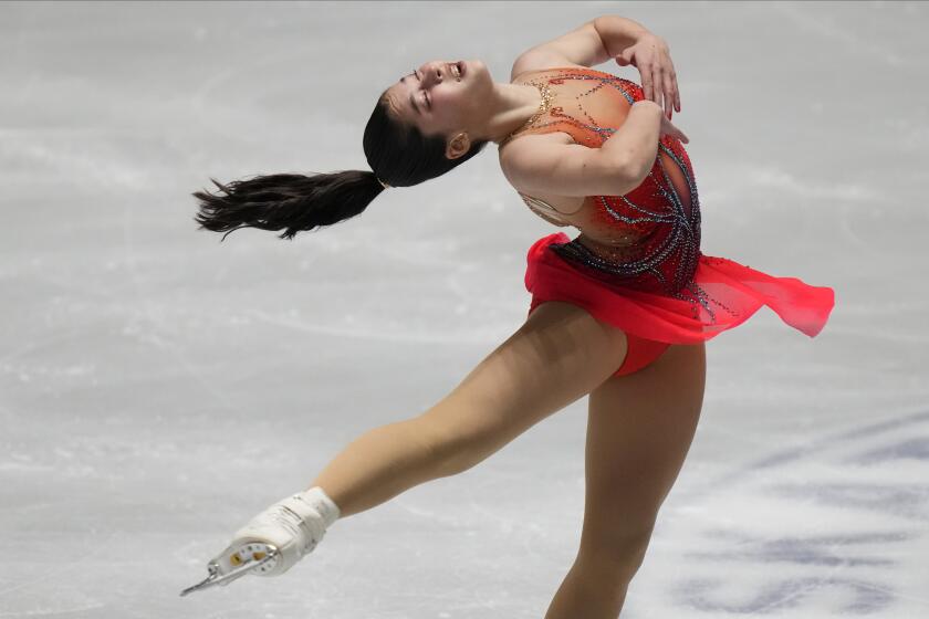Alysa Liu of the United States performs during the women's short program at the ISU Grand Prix of Figure Skating NHK Trophy competition in Tokyo, Japan, Friday, Nov. 12, 2021. (AP Photo/Shuji Kajiyama)