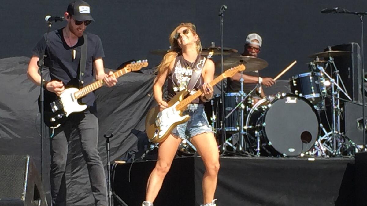 Canadian singer-songwriter-guitarist Lindsay Ell performing in April at the Stagecoach country music festival in Indio, flanked by guitarist Brian Smith and drummer Stephen Keith.