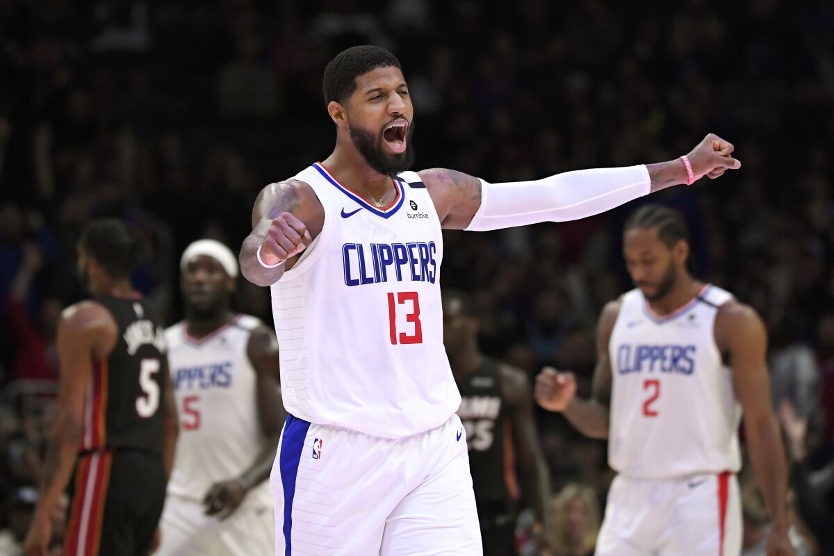 Clippers forward Paul George celebrates during a win over the Heat in February.