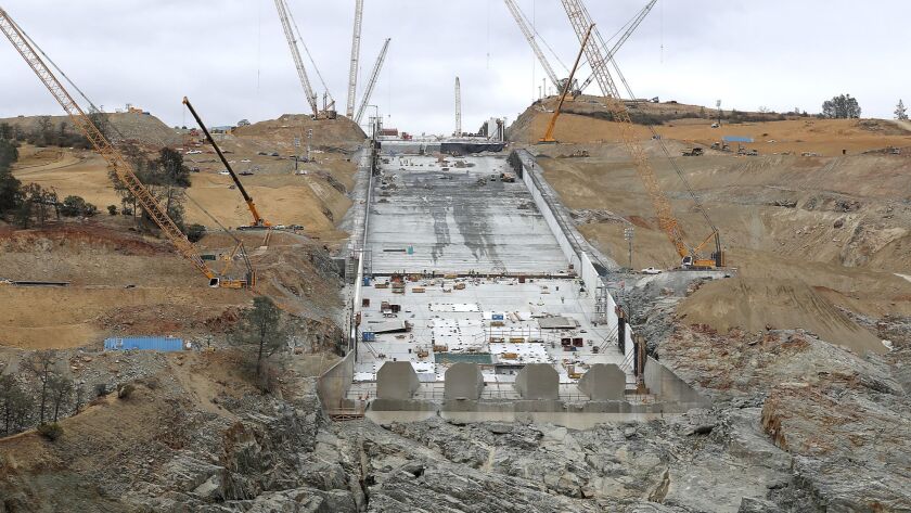 Construction crews work on the main spillway of the Oroville Dam on Oct. 19, 2017.