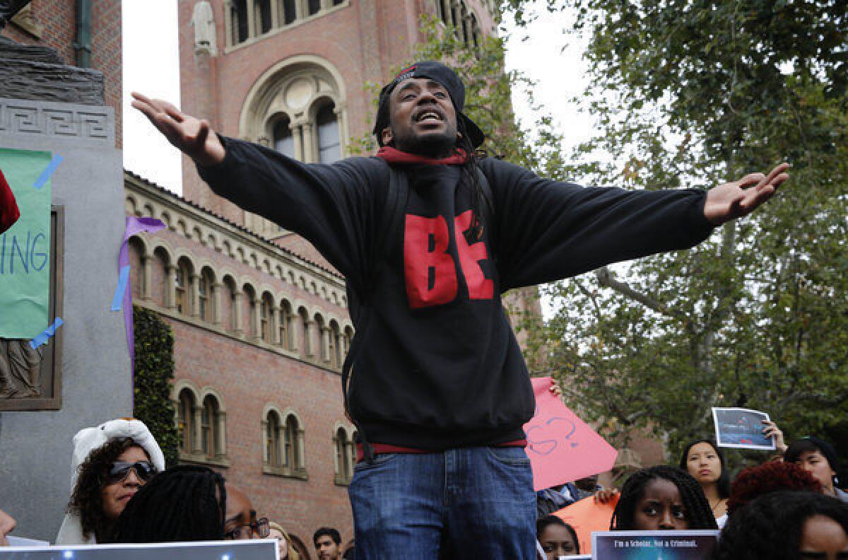 Nate Howard, a senior and communications major, makes a statement to a group of USC protesters about the controversial breakup of a party by LAPD officers.