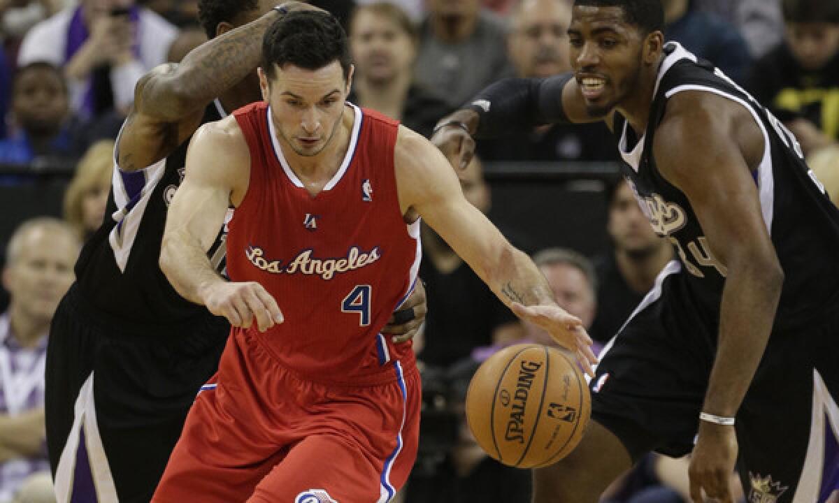 Clippers guard J.J. Redick steals the ball away from Sacramento Kings forward Jason Thompson during a Clippers' win Nov. 29. Redick most likely will be in the Clippers' starting lineup once he returns from injury.