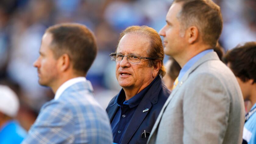 Chargers owner Dean Spanos, flanked by son John (left) and A.G. Spanos, watches a November 2016 game in San Diego.