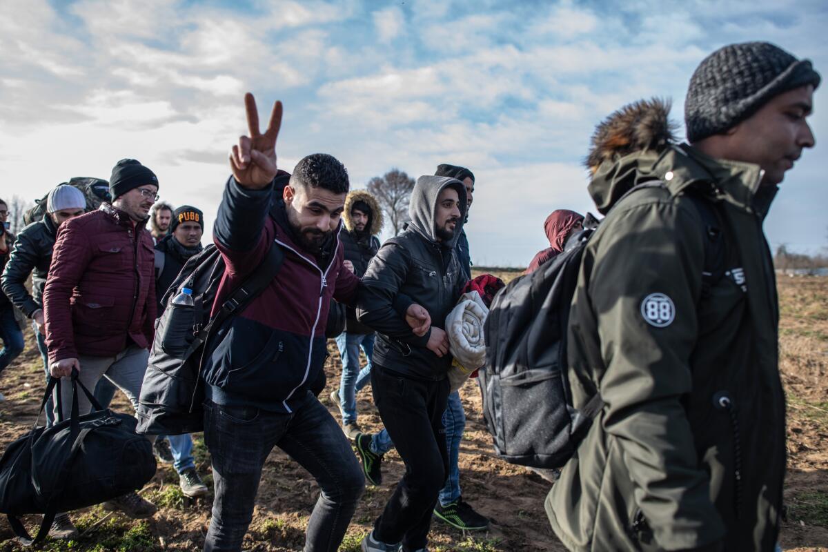 Refugees and migrants make their way through Edirne, Turkey