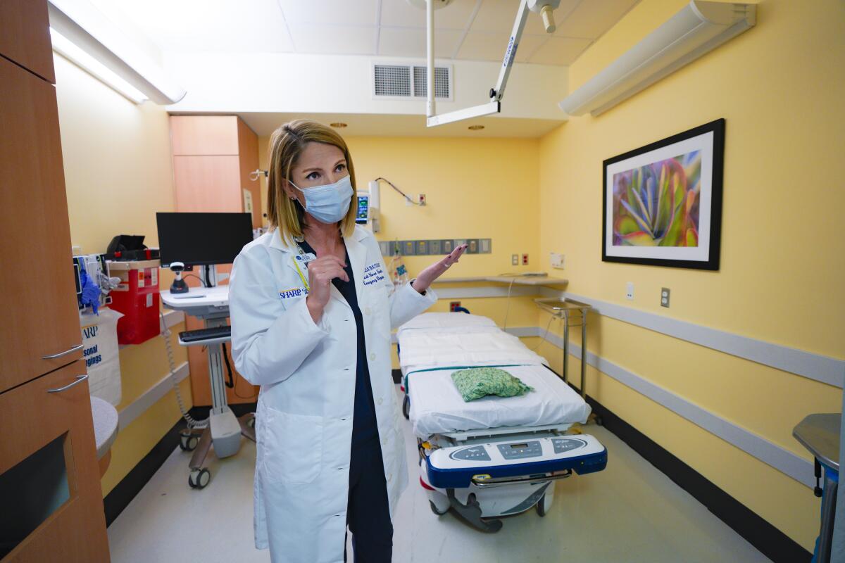 Julie Dye, a clinical nursing specialist, shows one of Sharp Grossmont Hospital’s new geriatric patient rooms.
