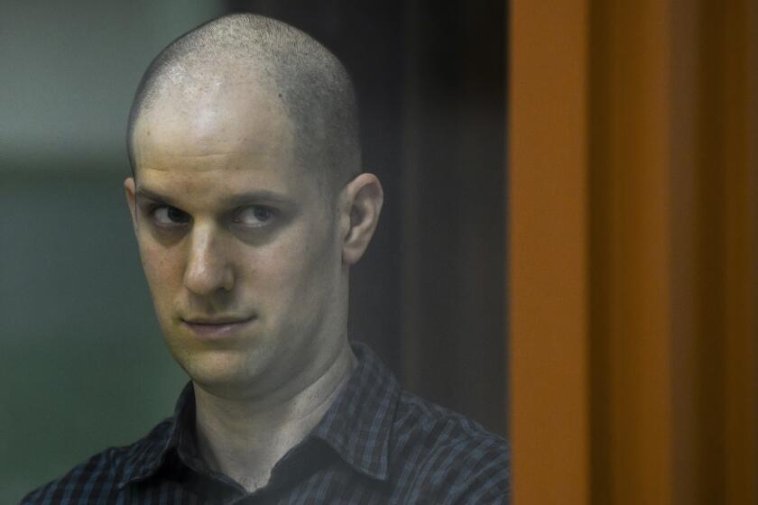Wall Street Journal reporter Evan Gershkovich stands in a glass cage in a courtroom in Yekaterinburg, Russia, Wednesday, June 26, 2024. Fifteen months after he was arrested in the city of Yekaterinburg on espionage charges, Gershkovich returns there for his trial starting Wednesday, June 26, 2024, behind closed doors. Gershkovich, his employer and the U.S. government deny the charges. (AP Photo)