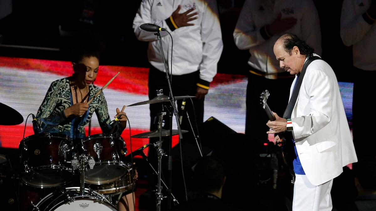 Carlos Santana and Cindy Blackman perform before Game 2 of the NBA Finals between the Golden State Warriors and the Cleveland Cavaliers in Oakland on June 5.