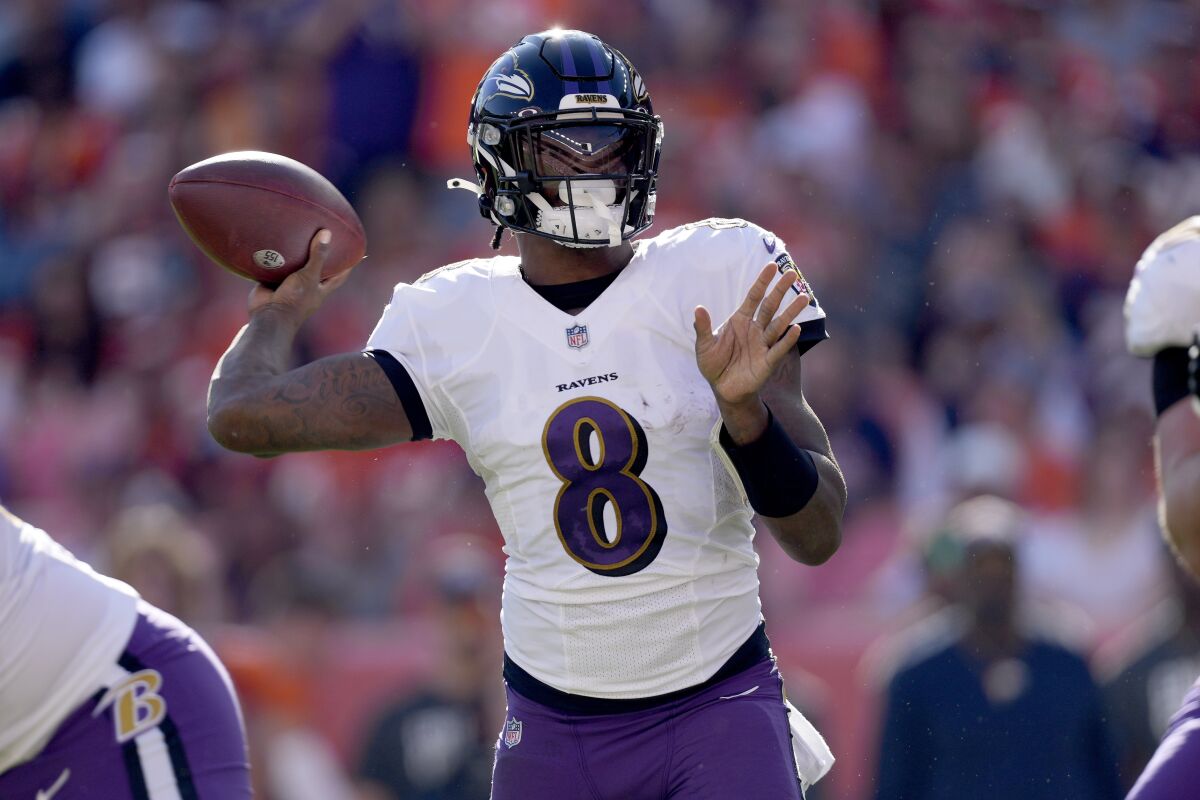 Baltimore Ravens quarterback Lamar Jackson (8) throws against the Denver Broncos during the first half of an NFL football game, Sunday, Oct. 3, 2021, in Denver. (AP Photo/David Zalubowski)