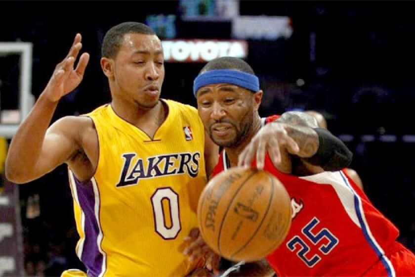 Andrew Goudelock defends against the Clippers' Mo Williams during a game last season.