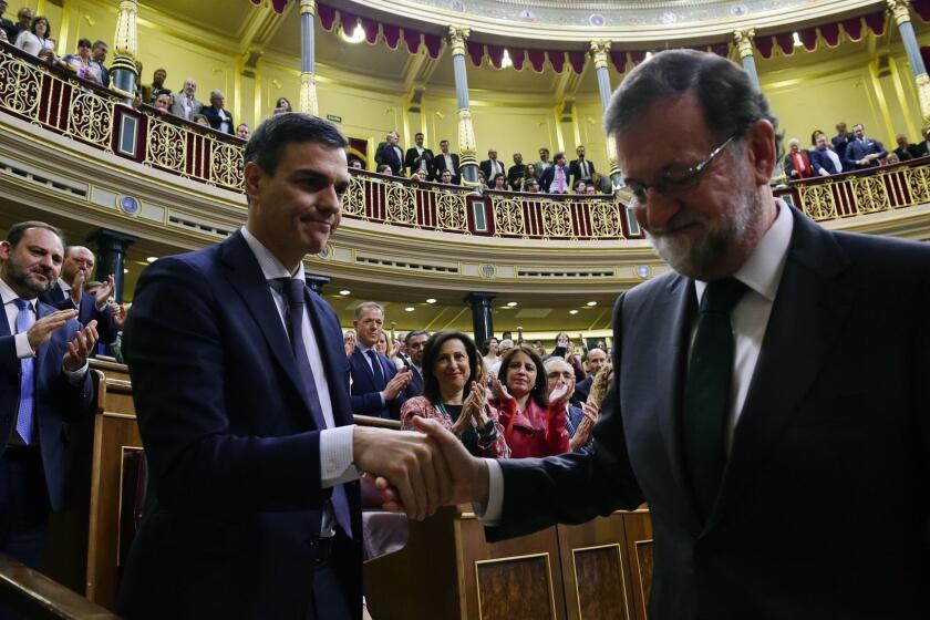 MADRID, SPAIN - JUNE 01: Spanish new Prime Minister Pedro Sanchez (L) shakes hands with former Prime Minister Mariano Rajoy (R) after Sanchez won the no-confidence motion at the Lower House of the Spanish Parliament on June 1, 2018 in Madrid, Spain. PSOE party filed a no-confidence motion against Mariano Rajoy as a reaction to the People's Party (PP) being convicted on the Gurtel corruption case. (Photo by Pierre-Philippe Marcou - Pool/Getty Images) *** BESTPIX *** ** OUTS - ELSENT, FPG, CM - OUTS * NM, PH, VA if sourced by CT, LA or MoD **