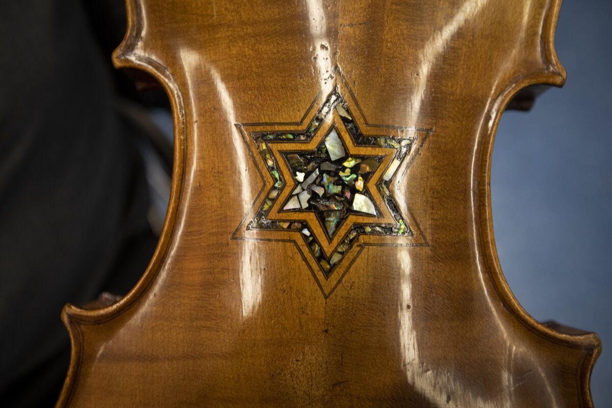 A detail of a Star of David on the back of a Violins of Hope instrument