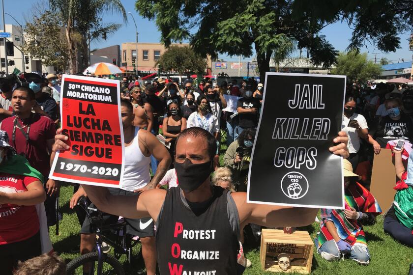 Protesters gather Sautrday, August 29, 2020, at Ruben Salazar Park in Los Angeles to commemorate the 50th anniversary of the Chicao Moratorium.