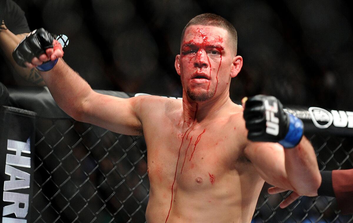 Nate Diaz celebrates his win over Conor McGregor after their non-title welterweight fight at UFC 196.