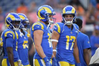 Rams receivers Cooper Kupp (10) and Puka Nacua (17) chat in the preseason.