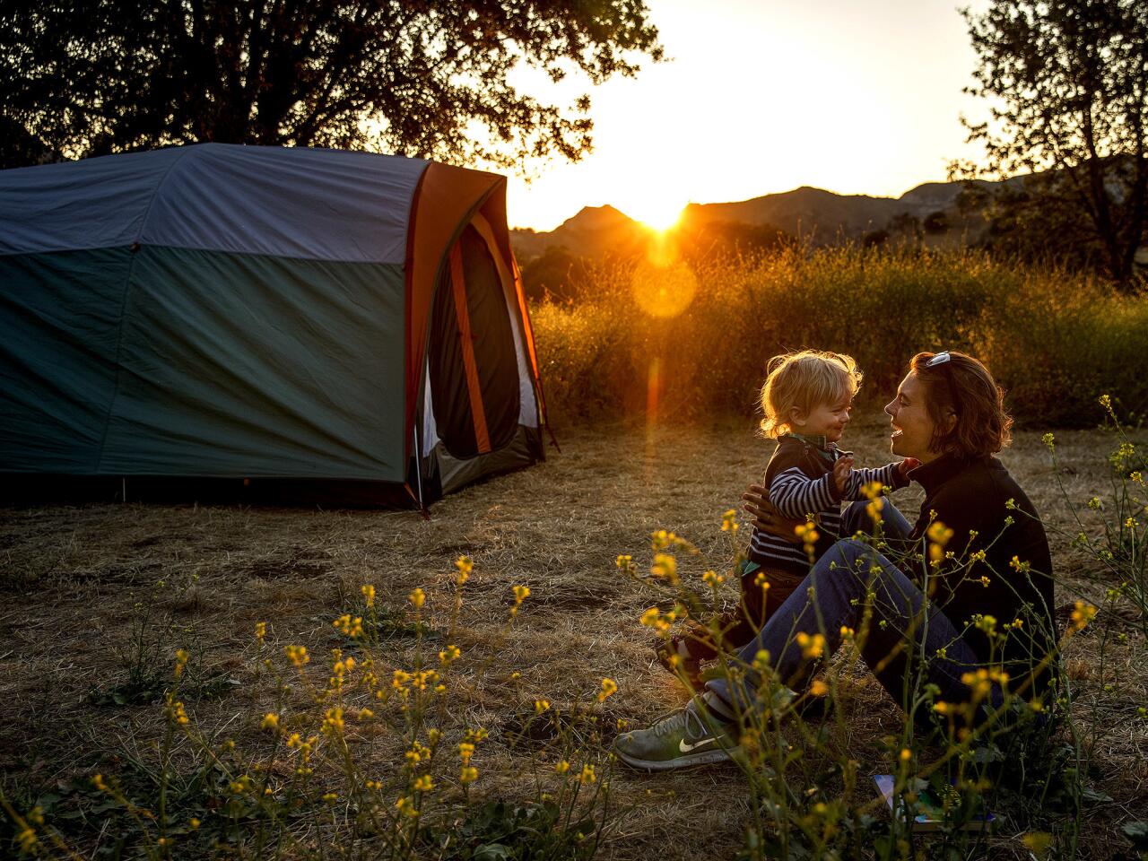 Sarah Raich, from Munich, Germany, enjoys a moment with her son Kolja, 1, as the sun sets on their campsite at Malibu Creek State Park in Calabasas.