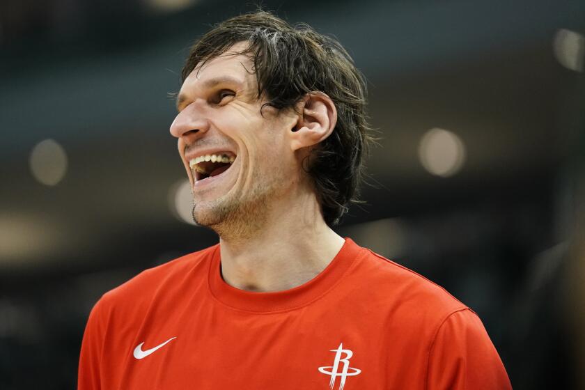 Houston Rockets' Boban Marjanovic laughs while warming up before an NBA basketball game.