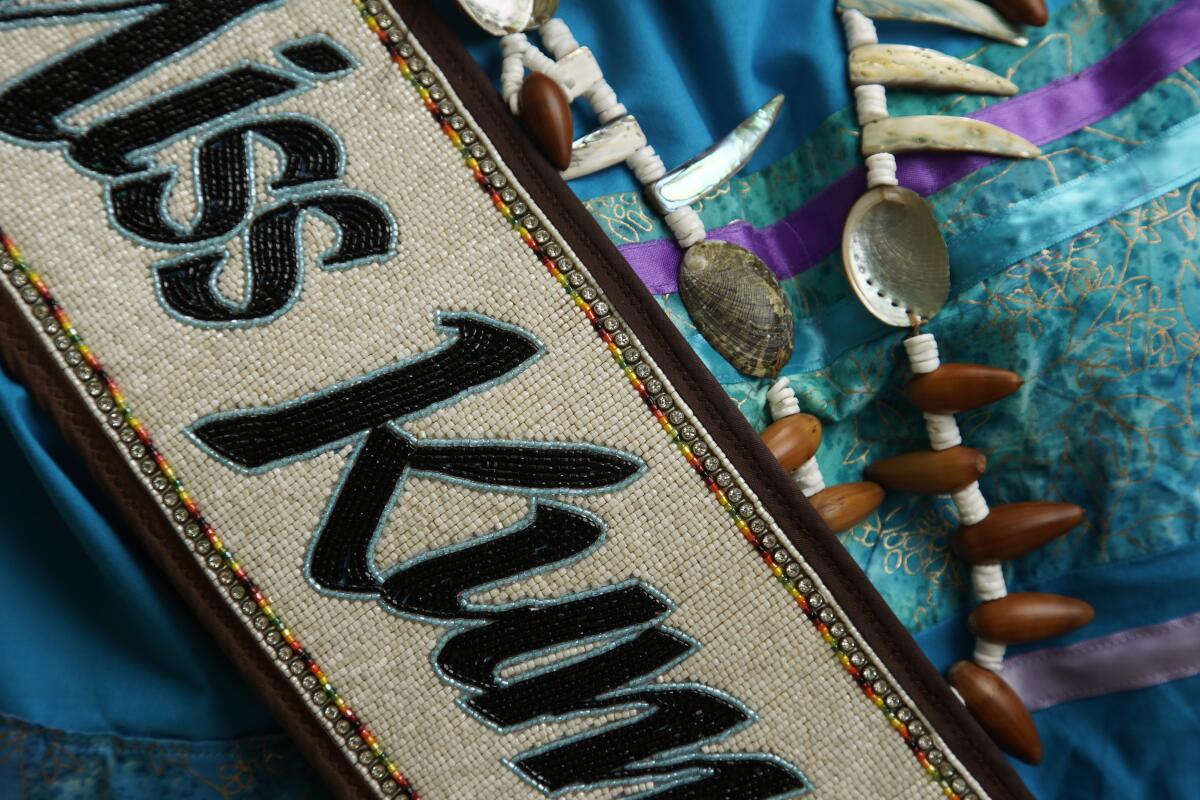 close up of a beaded sash that reads Miss Kumeyaay Nation