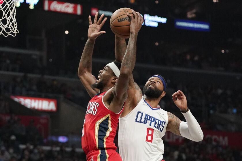 New Orleans Pelicans forward Naji Marshall, left, has his shot blocked by Los Angeles Clippers forward Marcus Morris Sr.
