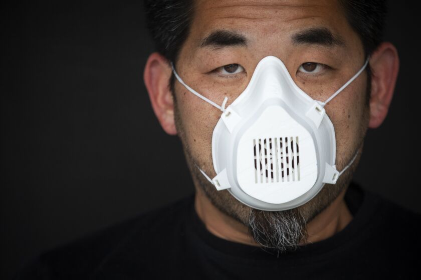 ALHAMBRA, CA - APRIL 06: Portrait of architect Alvin Huang at his home on Monday, April 6, 2020 in Alhambra, CA. He is making as 3D-printing masks for medical workers. He says it is not equal to an N95 mask but it's better then a bandana. (Francine Orr / Los Angeles Times)