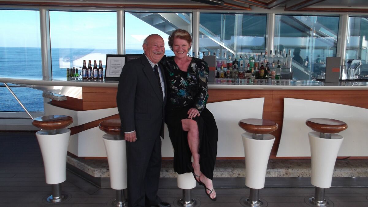 Marie Falcon and her husband Rene pose on a cruise ship off the coast of France last March 2020