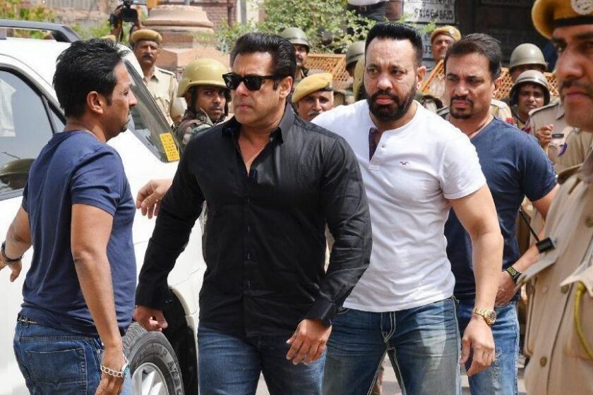 Bollywood star Salman Khan, second left, arrives to appear before a court in Jodhpur, Rajasthan state, India, Thursday, April 5, 2018. Khan was convicted Thursday of poaching rare deer in a wildlife preserve two decades ago and could face up to six years in prison. (AP Photo/Sunil Verma)