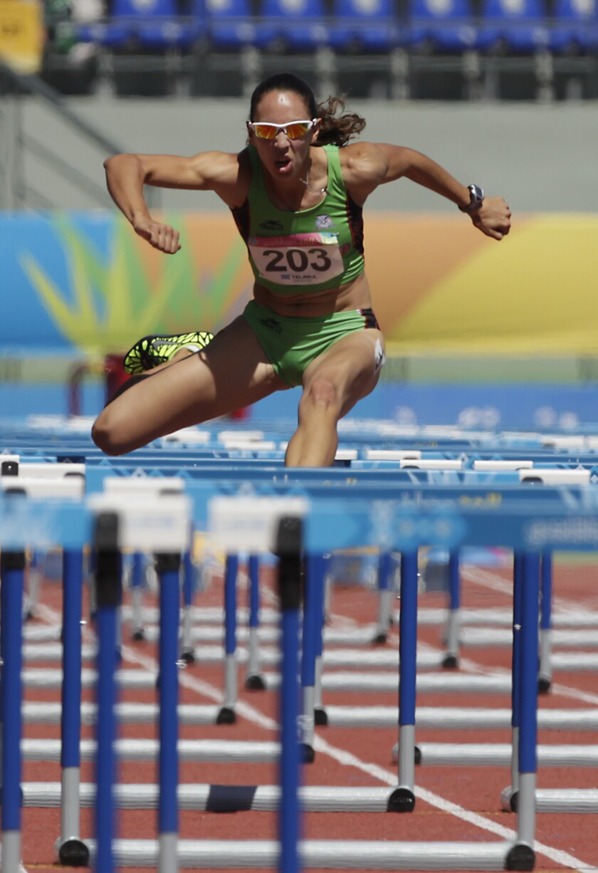 Karla Schleske competes for Mexico in the women's 100-meter hurdles at the Pan American Games in October 2011.