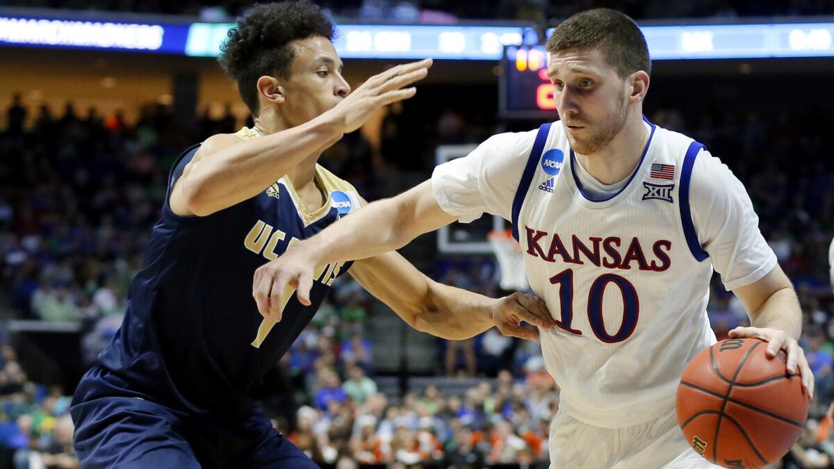 Guard Sviatoslav Mykhailiuk (10) and Kansas will attempt to advance to the Final Four on Saturday when the Jayhawks take on Oregon in the Midwest Regional final. (Tony Gutierrez / Associated Press)