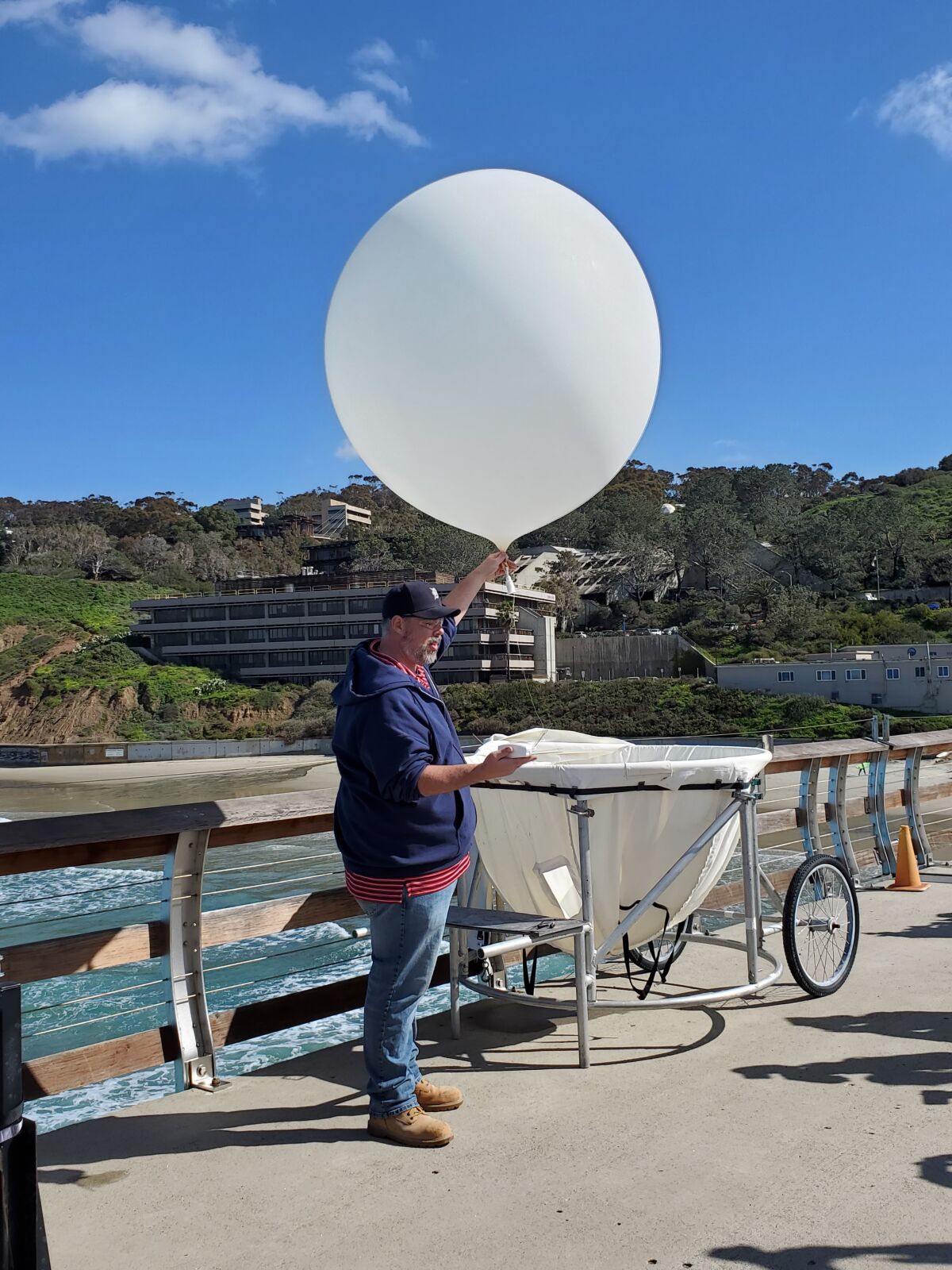 David Oaks prepares to launch the first weather balloon of the Eastern Pacific Cloud Aerosol Precipitation Experiment.