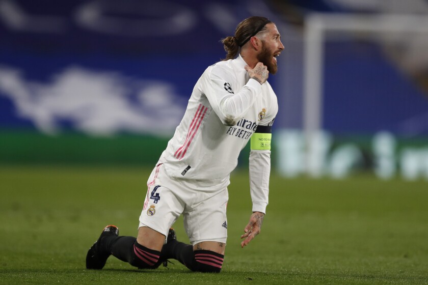 Real Madrid's Sergio Ramos gestures during the Champions League semifinal 2nd leg soccer match between Chelsea and Real Madrid at Stamford Bridge in London, Wednesday, May 5, 2021. (AP Photo/Alastair Grant)