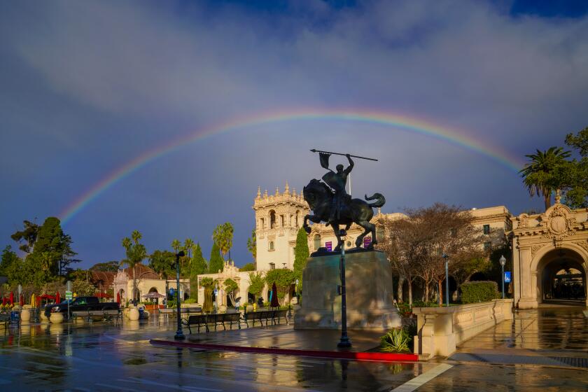After the rain shower in San Diego on February 5th, a large rainbow formed over the city, framing the bronze statue of El Cid Campeador in Balboa Park.