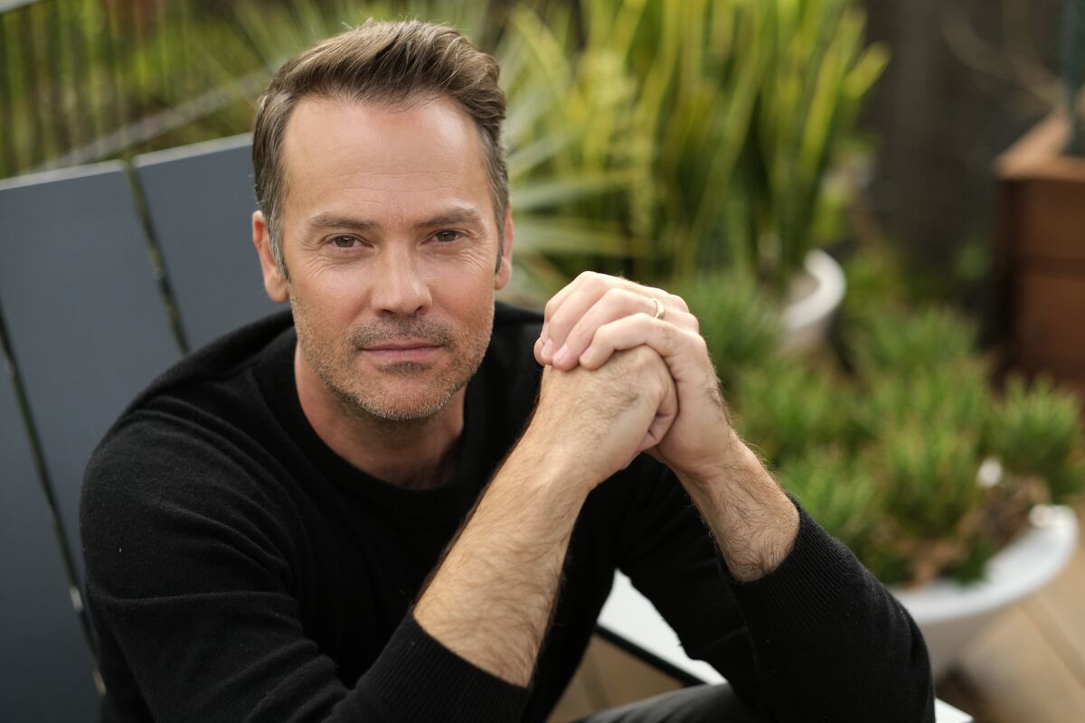 Actor Barry Watson poses for a portrait at his home in the Brentwood section of Los Angeles on Friday, Oct. 22, 2021, to promote a reboot of the Michael Landon TV series “Highway to Heaven," which co-stars Jill Scott as an angel sent to earth to help people. (AP Photo/Chris Pizzello)