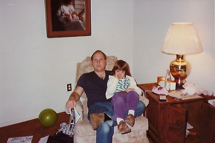 Joseph DeAngelo in April 1983 at his Citrus Heights home with a visiting niece, a daughter of James Huddle. Photo provided by James Huddle. Behind in the wall is a photograph of DeAngelo's wife and infant child.