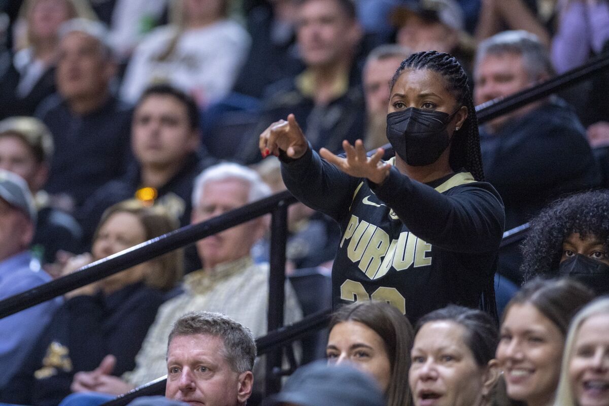 Niele Ivey, mother of Purdue guard Jaden Ivey (23), reacts to action on the court during the first half of an NCAA college basketball game against Rutgers, Sunday, Feb. 20, 2022, in West Lafayette, Ind. Niele is the head coach of Notre Dame's women's basketball team. (AP Photo/Doug McSchooler)