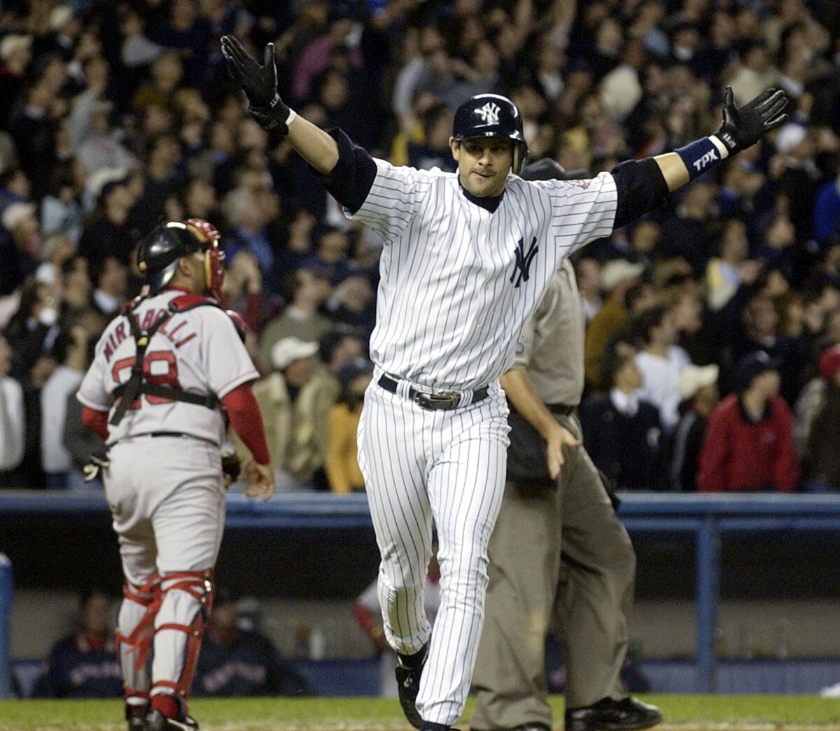 Aaron Boone celebrates after hitting a game-winning home run against the Red Sox in the 11th inning of Game 7 of the ALCS in 2003.