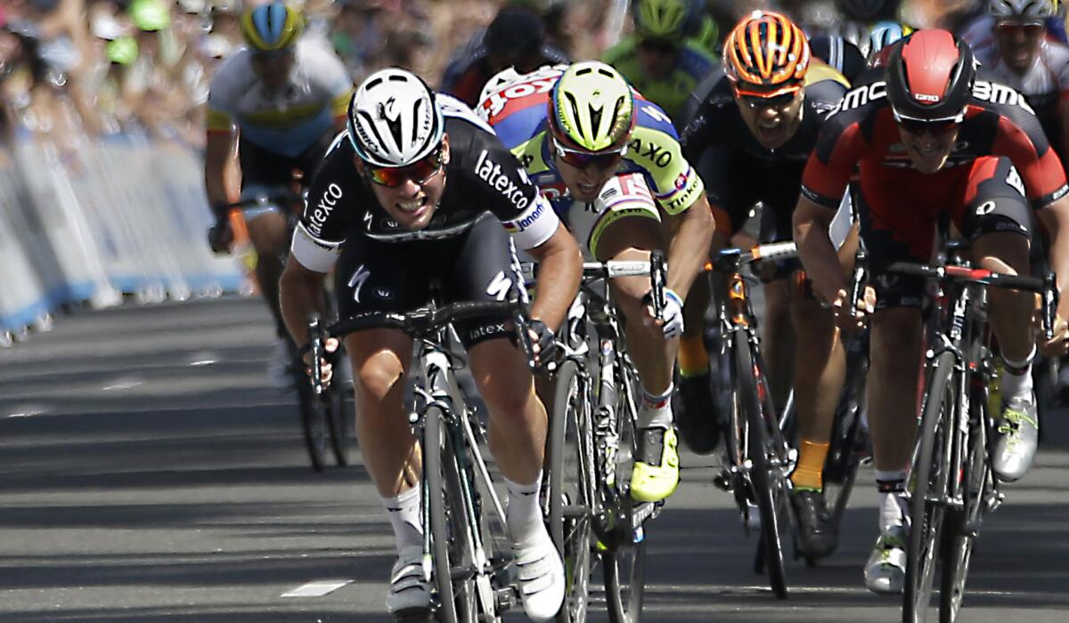 Mark Cavendish wins the sprint to the finish to claim victory in the first state of the Amgen Tour of California on Sunday in Sacramento.