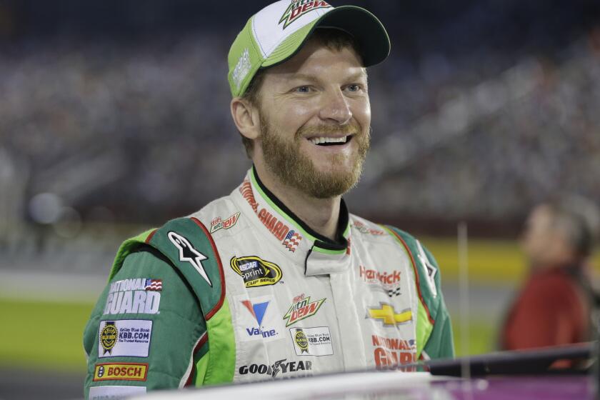 Dale Earnhardt Jr. smiles Oct. 9 before qualifying for Saturday's NASCAR Bank of America Sprint Cup series race at Charlotte Motor Speedway in Concord, N.C.