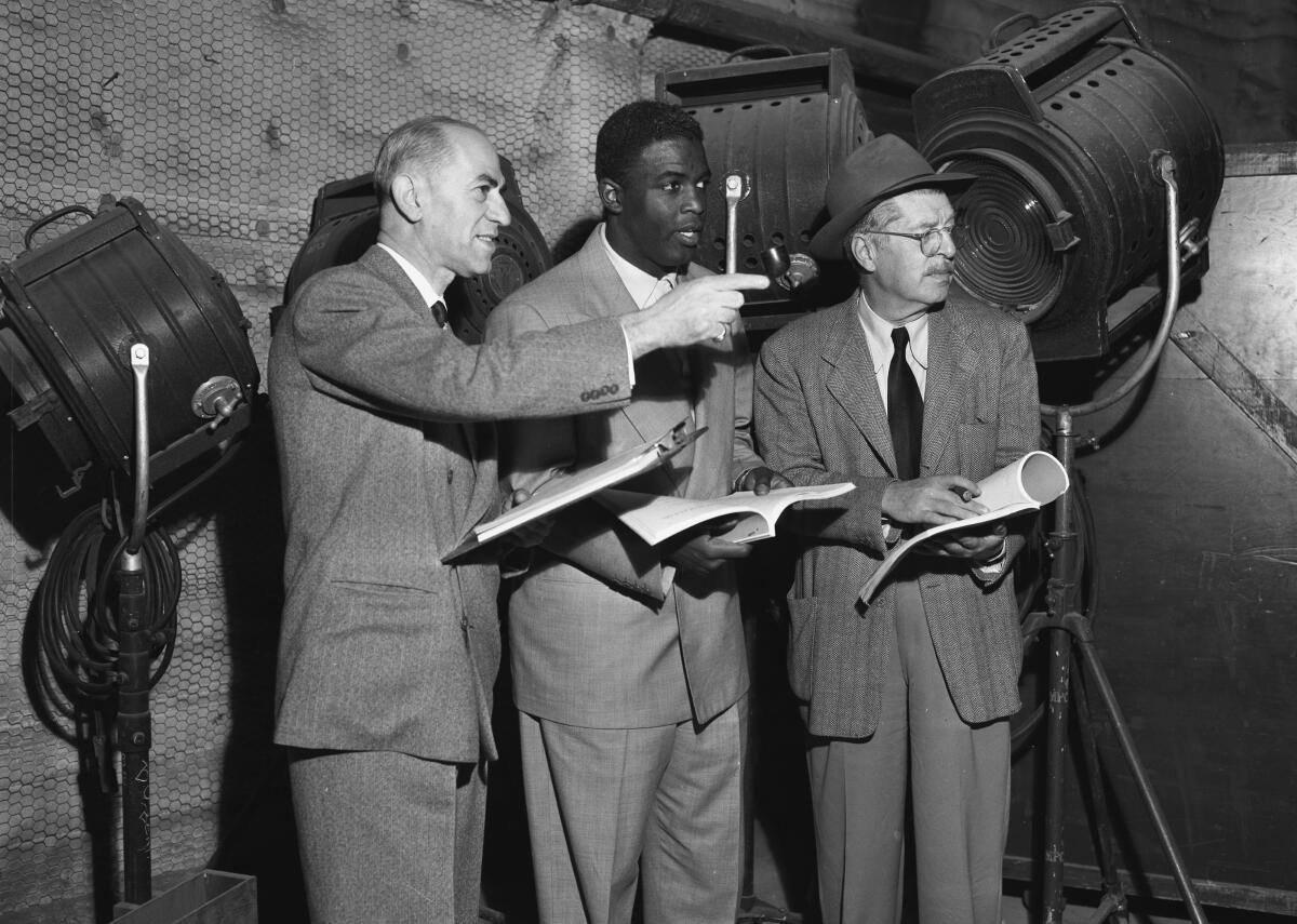 Jackie Robinson, Joe Nadel, and Al Green on the set of "The Jackie Robinson Story" in Los Angeles in 1950.